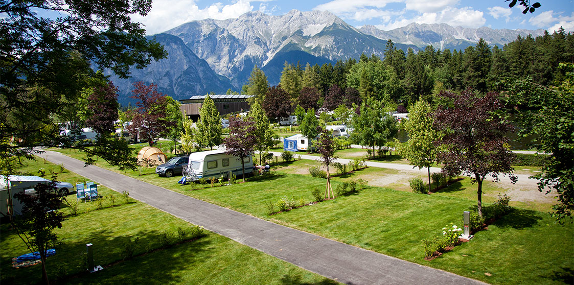 Campers parked at a park in the mountains.