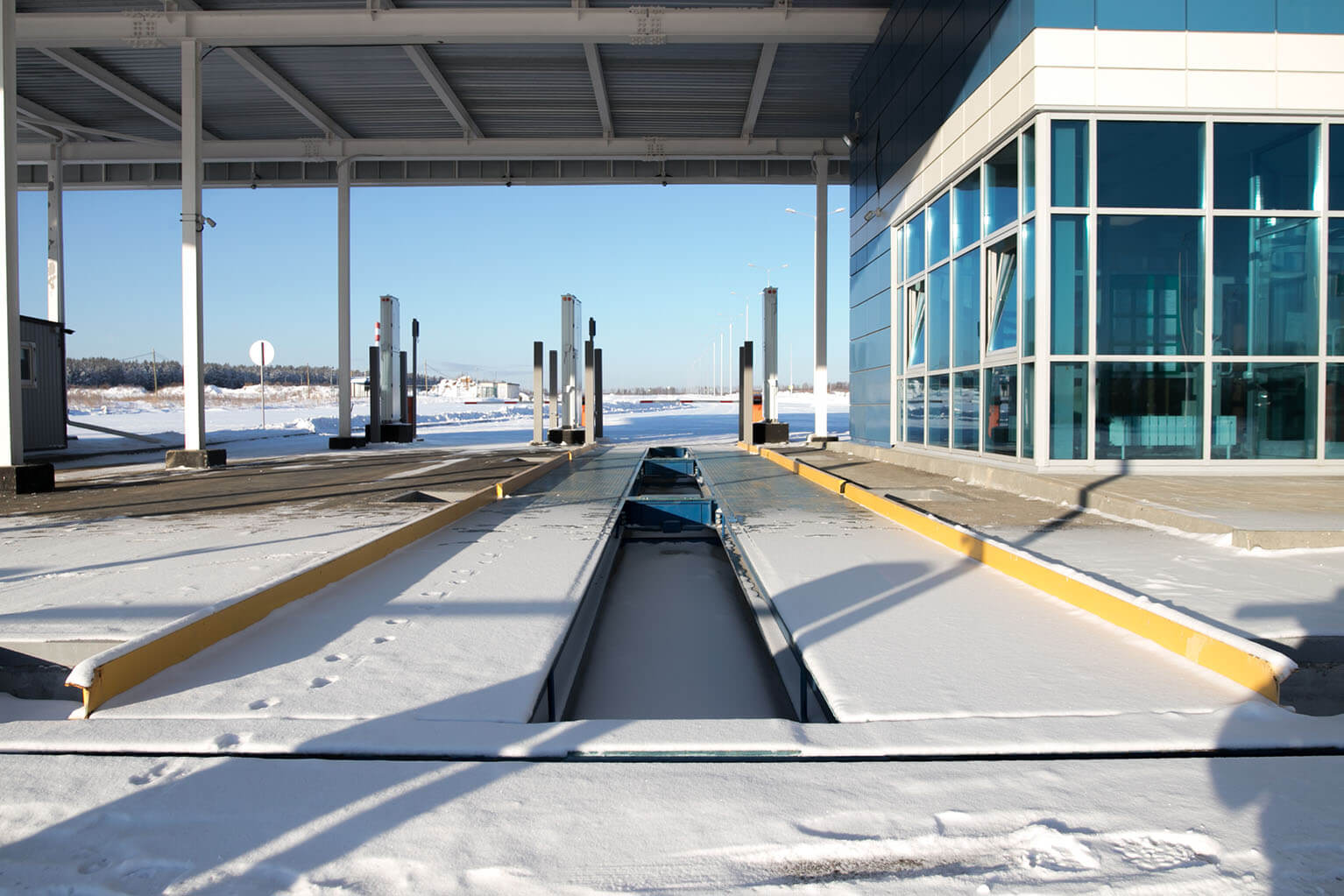 A DOT scale station covered in snow.